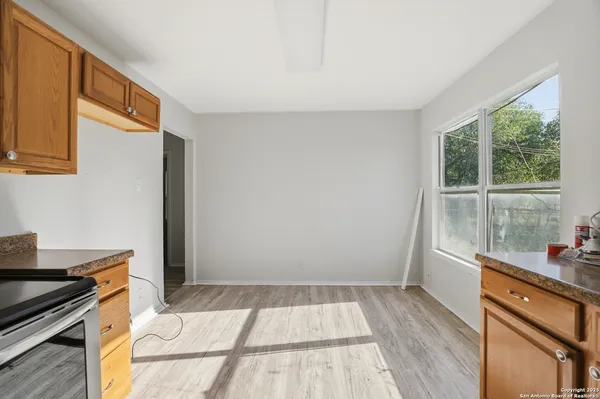 a kitchen with a sink and wooden cabinets