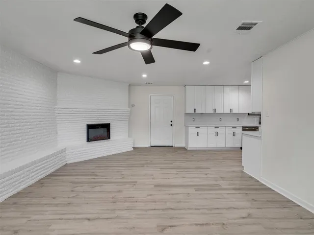 a view of a kitchen with a sink and dishwasher