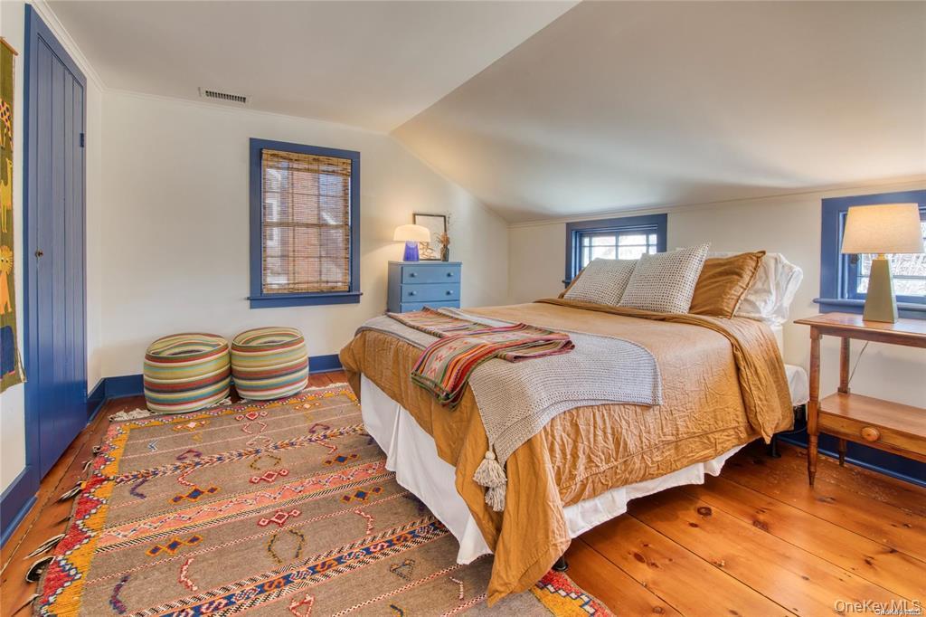 1800 Village Lane Orient, NY 11957 - Photo 5 of 12 Bedroom with hardwood / wood-style flooring and vaulted ceiling