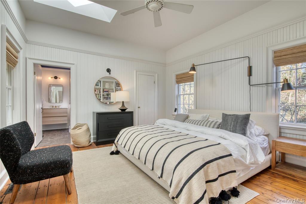 1800 Village Lane Orient, NY 11957 - Photo 8 of 12 Bedroom with wood-type flooring, ceiling fan, and a skylight