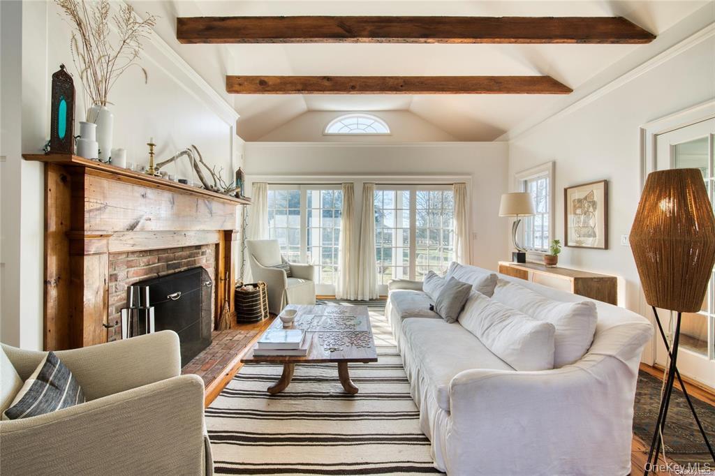 1800 Village Lane Orient, NY 11957 - Photo 10 of 12 Living room with a brick fireplace
