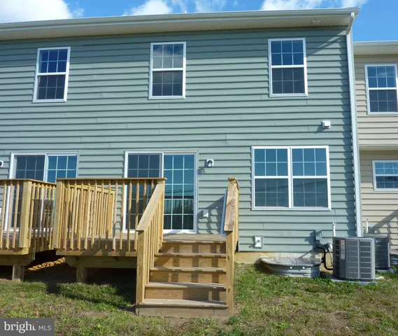 a view of a garden with a building in the background