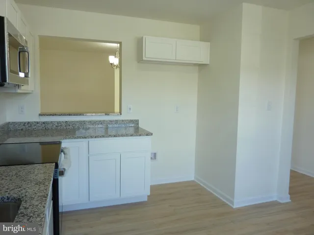 a view of a kitchen with cabinets