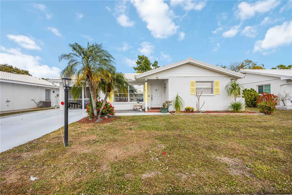 3801 Chinaberry Road Bradenton, FL 34208 - Photo 2 of 31 a view of a house with backyard and a tree