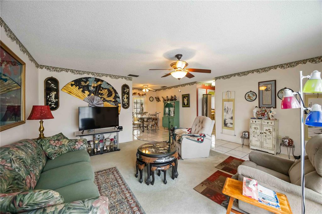 3801 Chinaberry Road Bradenton, FL 34208 - Photo 5 of 31 a living room with furniture and a flat screen tv