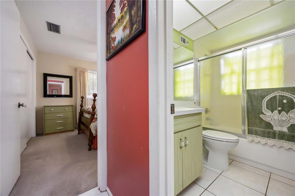 3801 Chinaberry Road Bradenton, FL 34208 - Photo 10 of 31 a bathroom with a toilet sink and a shower