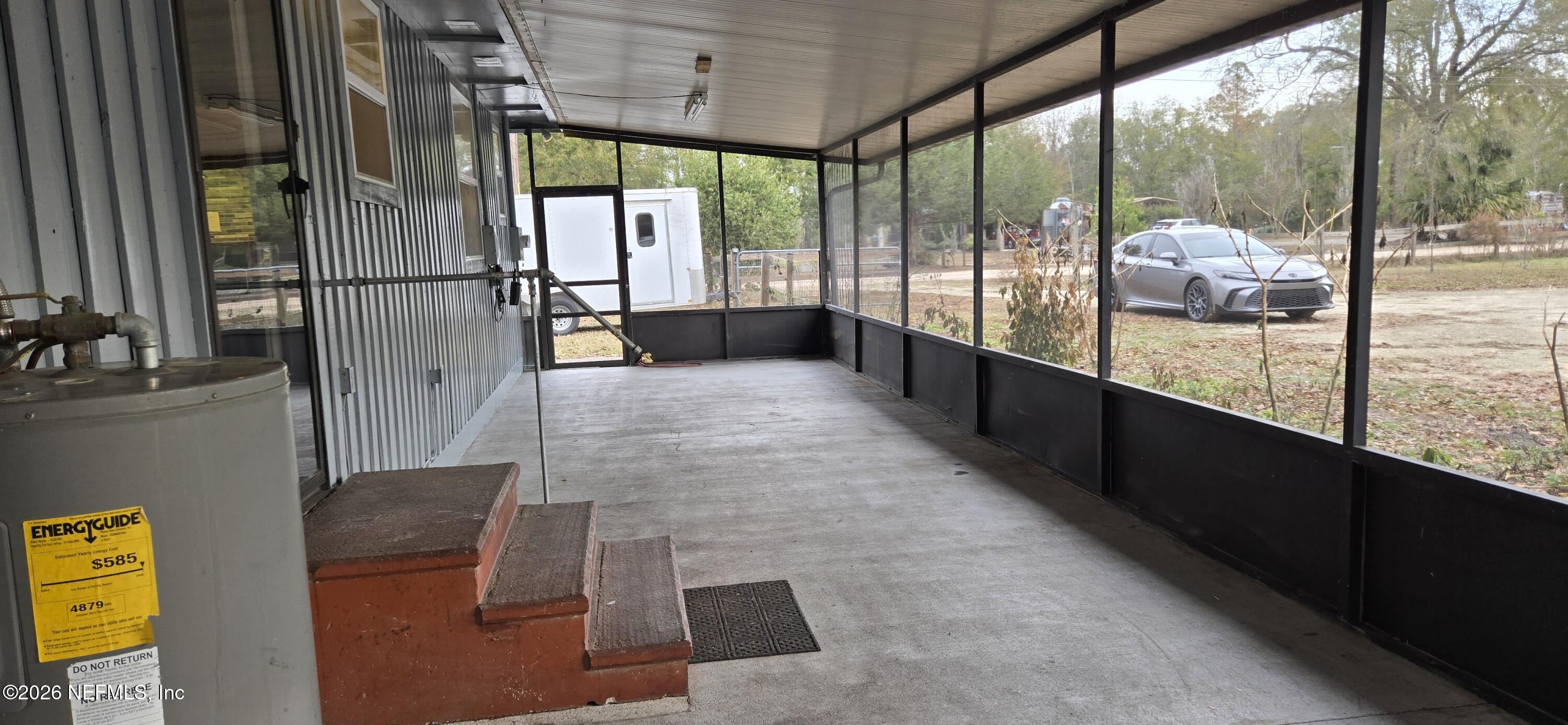 2720 Crystal Place Hilliard, FL 32046 - Photo 19 of 35 a view of a glass door with a balcony