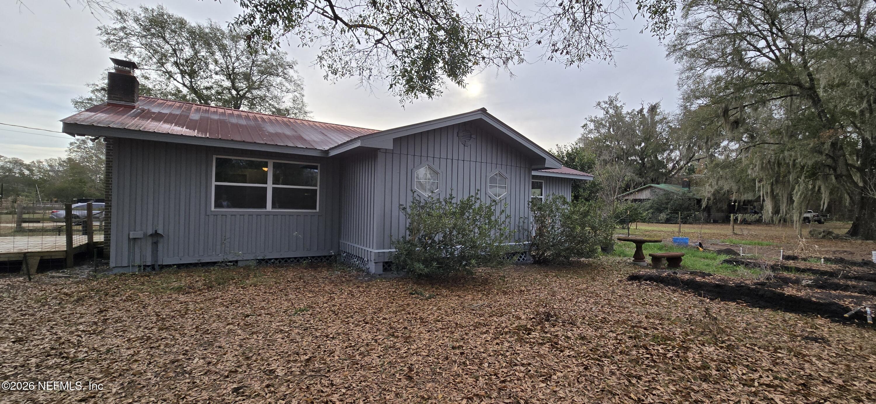 2720 Crystal Place Hilliard, FL 32046 - Photo 2 of 35 a view of a house with a yard and sitting area