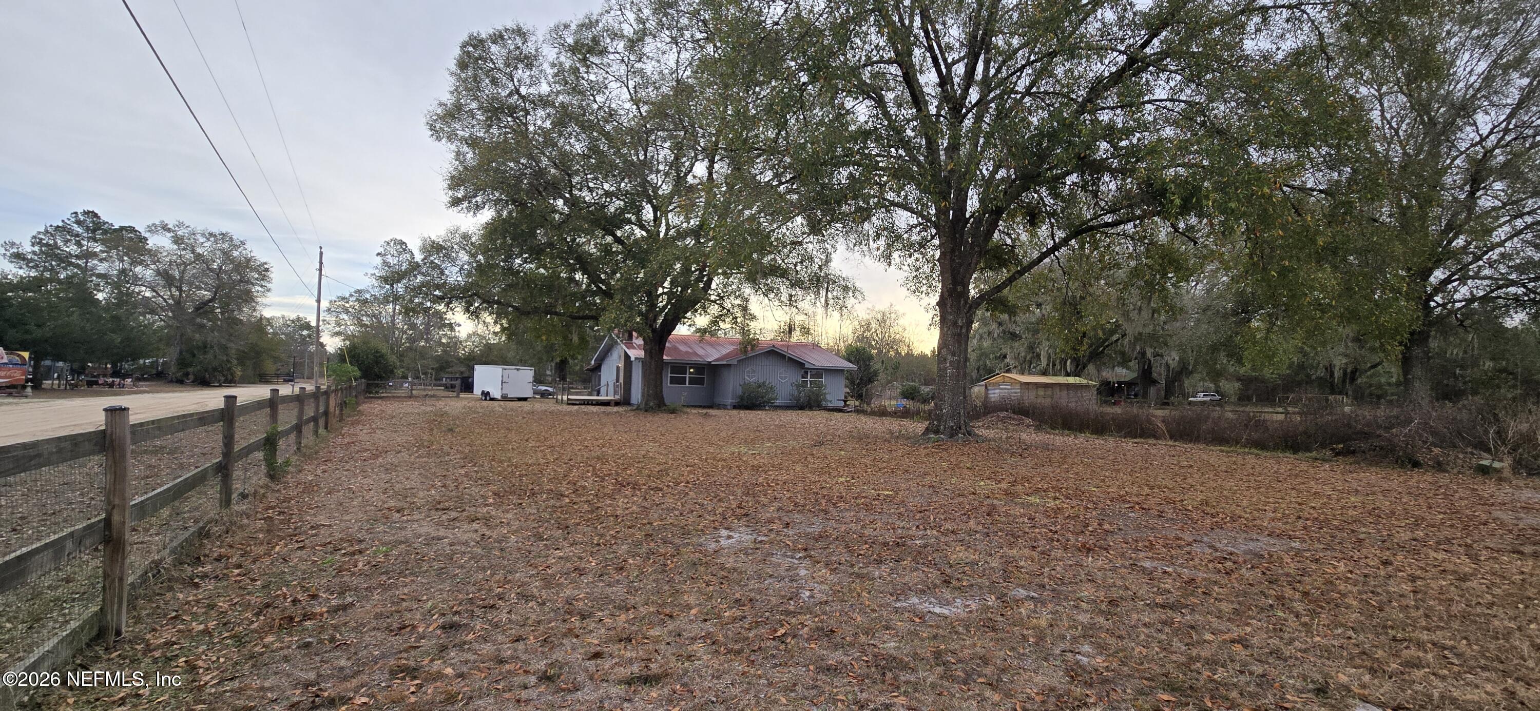 2720 Crystal Place Hilliard, FL 32046 - Photo 23 of 35 a view of a yard with a tree