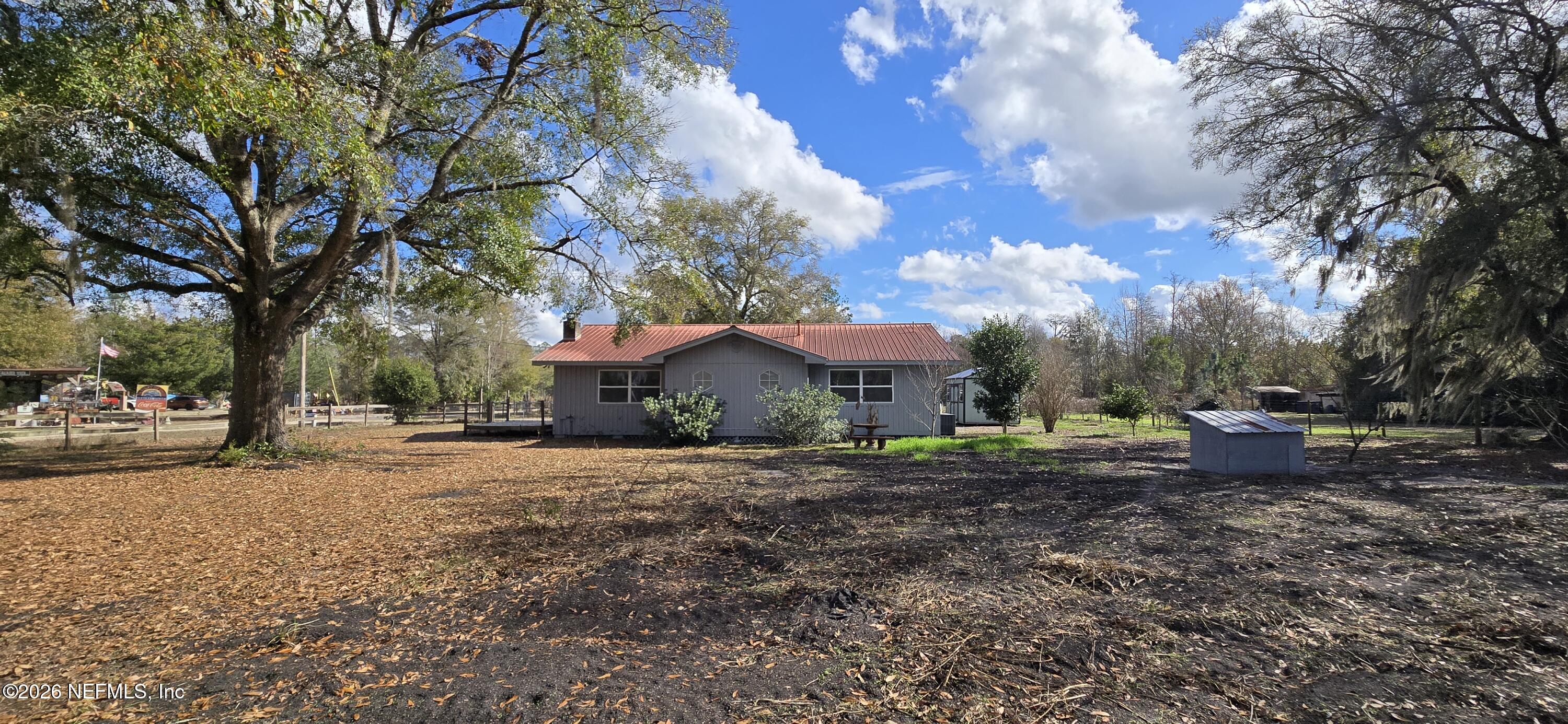 2720 Crystal Place Hilliard, FL 32046 - Photo 29 of 35 a view of a house with a yard