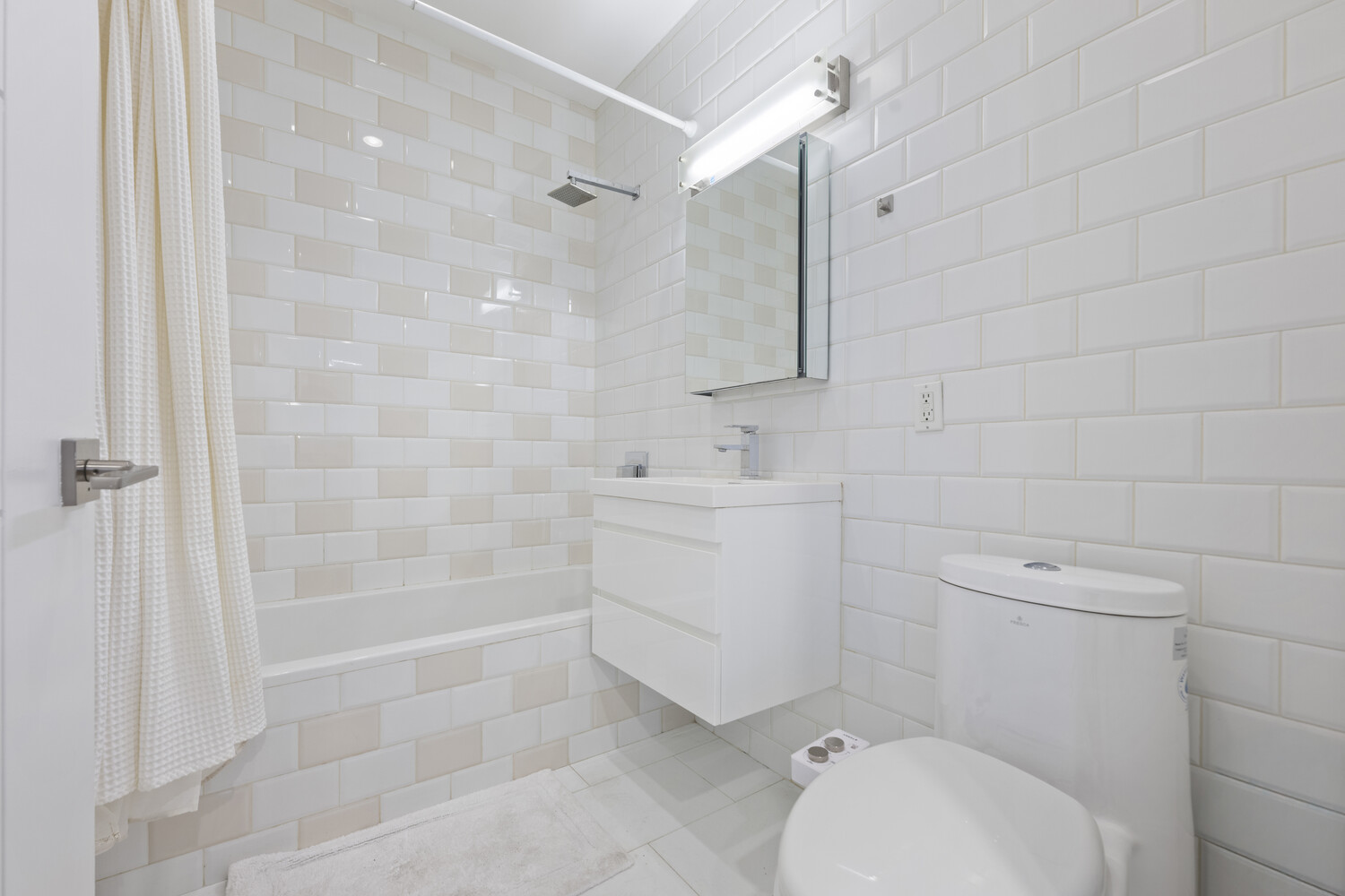 79 Clay Street, Unit 1R Brooklyn, NY 11222 - Photo 7 of 11 a bathroom with a sink a toilet and shower