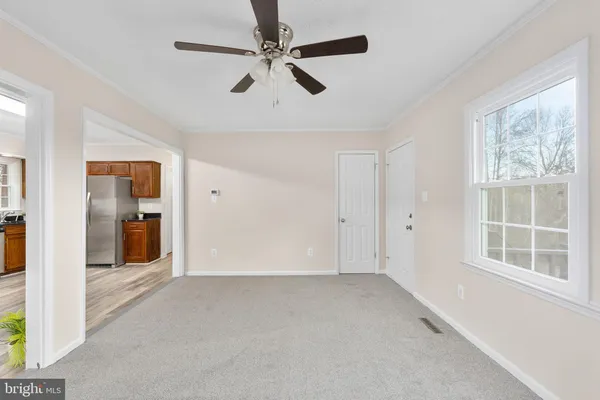 a view of an empty room with a window