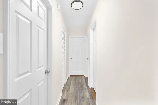 a view of a livingroom with a ceiling fan and window
