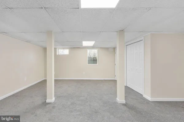 a view of a storage & utility room with dryer and washer