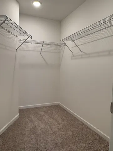 a view of a room with racks on the wall