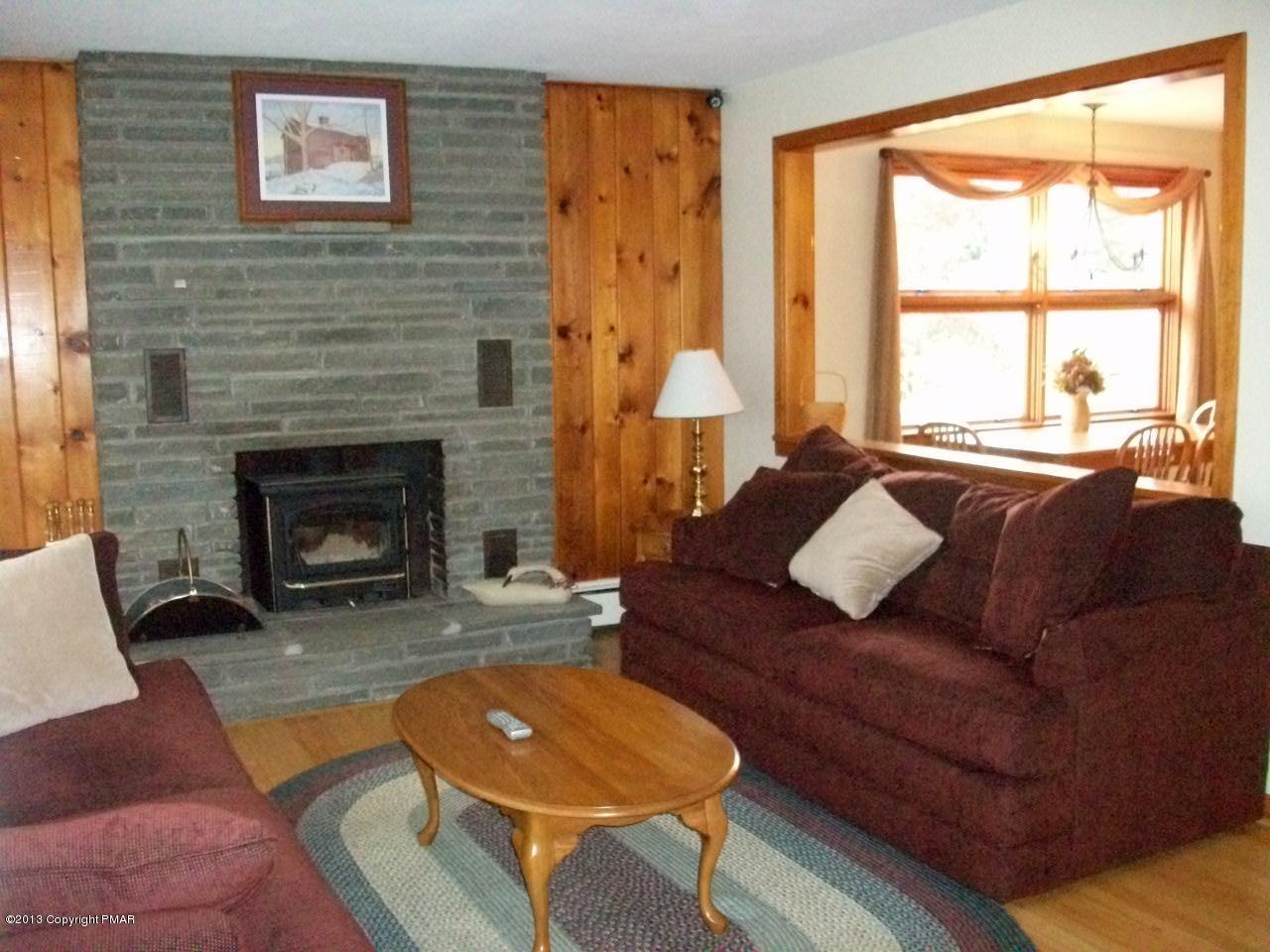 5758 Neola Road Stroudsburg, PA 18360 - Photo 20 of 43 a living room with furniture and a fireplace