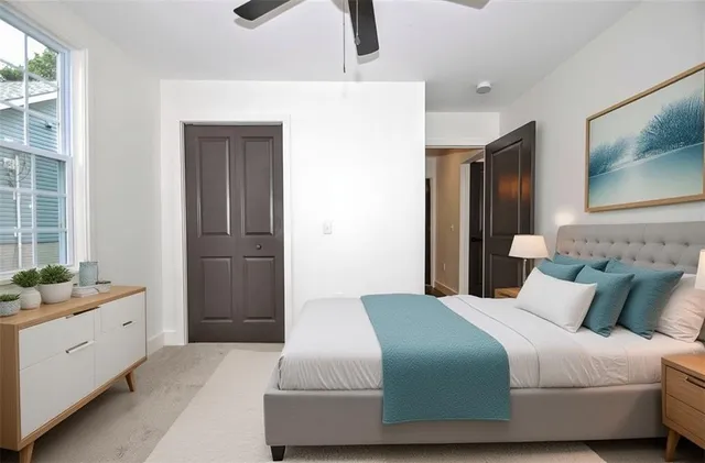 a bedroom with a bed and a window