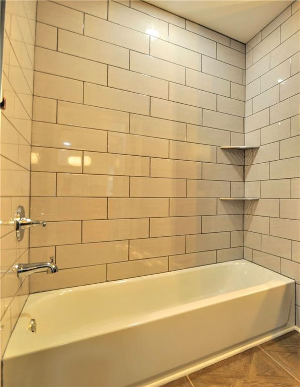 7914 Hemlock Street Pittsburgh, PA 15237 - Photo 23 of 37 a bathroom with a bathtub and shower