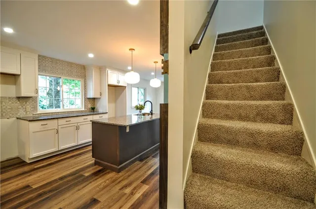 a view of kitchen with wooden floor and window