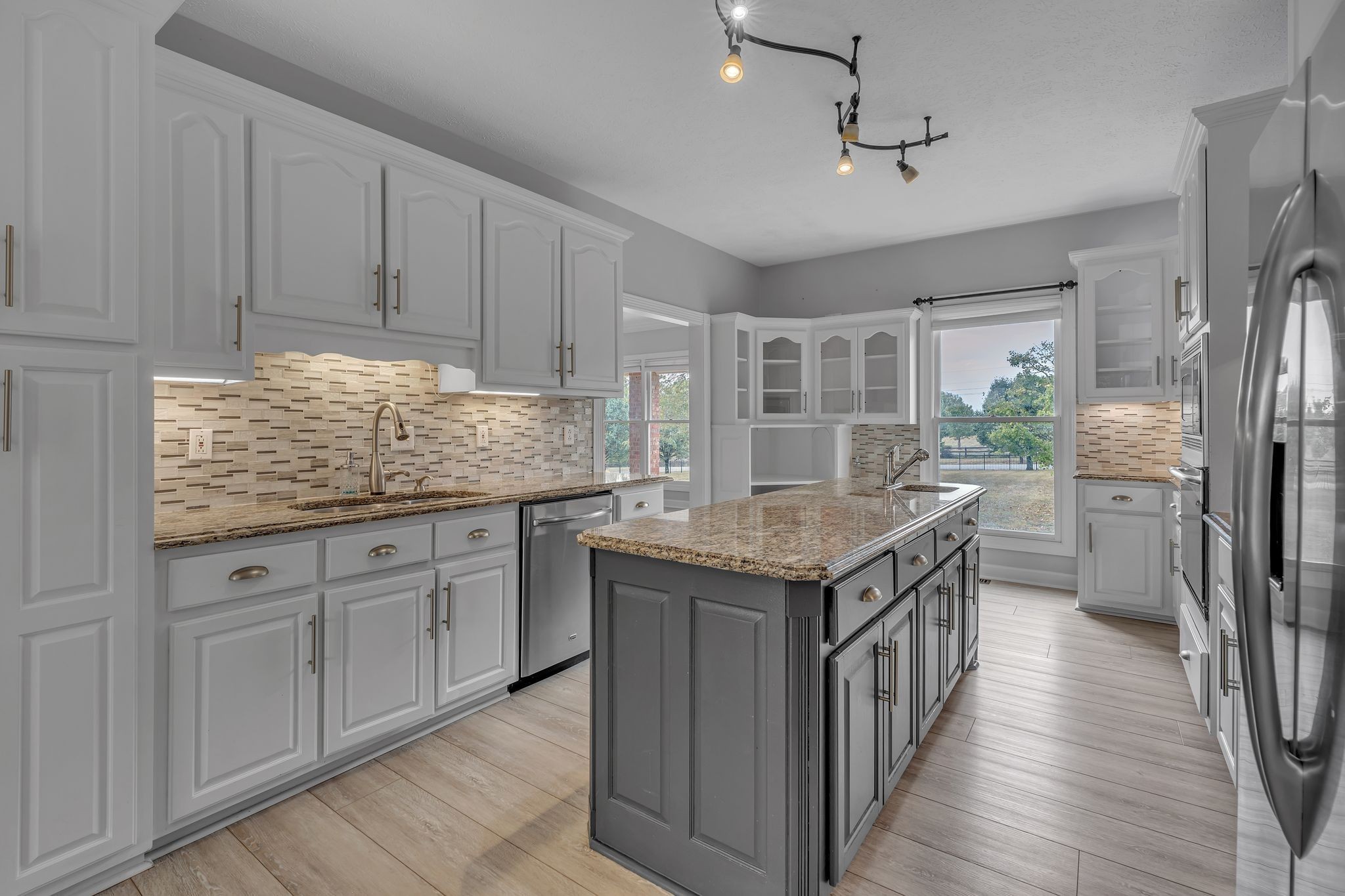 2103 Liebengood Road Goodlettsville, TN 37072 - Photo 28 of 97 a kitchen with stainless steel appliances granite countertop a stove and refrigerator