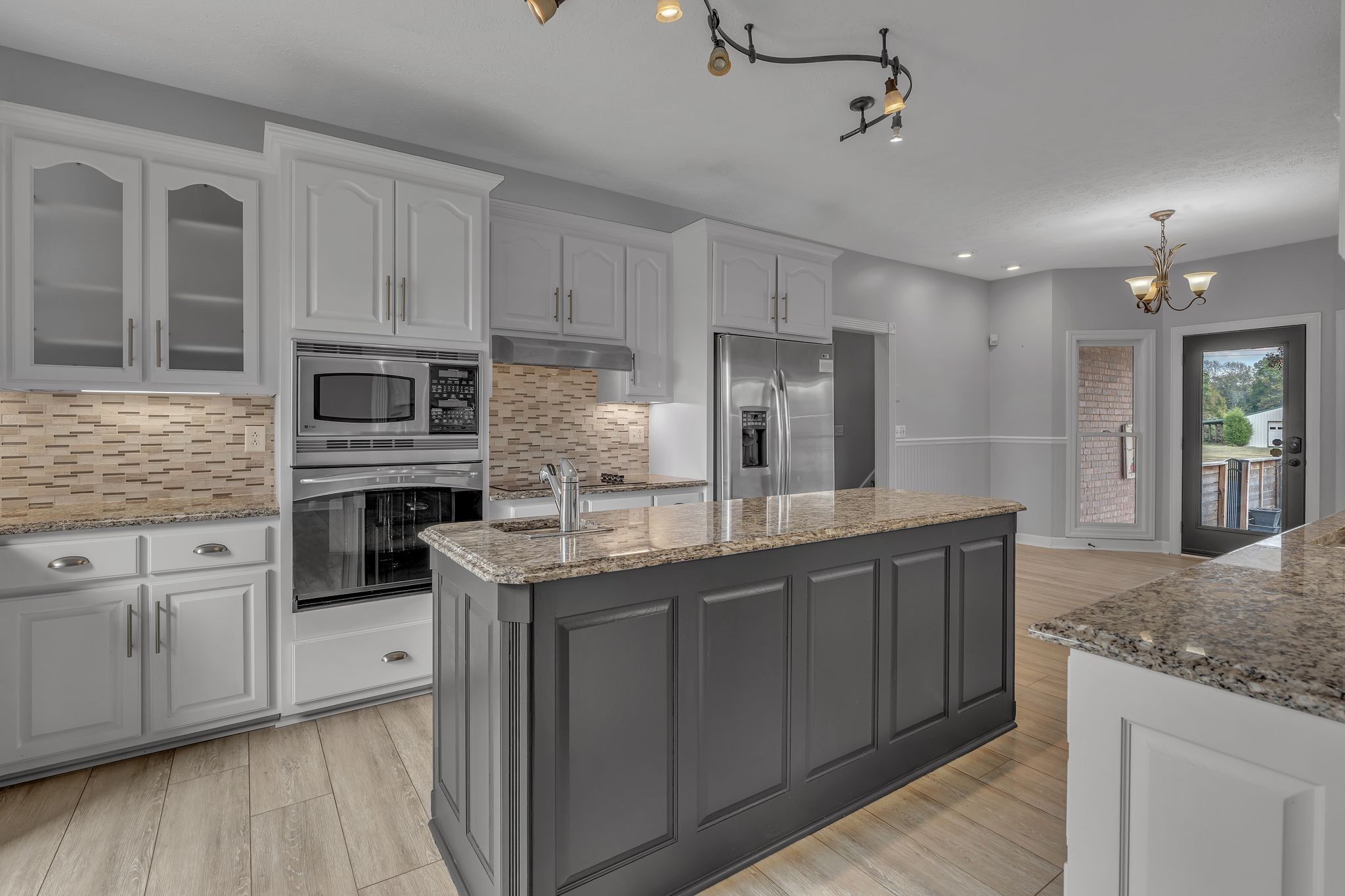 2103 Liebengood Road Goodlettsville, TN 37072 - Photo 30 of 97 a kitchen with stainless steel appliances granite countertop a sink and refrigerator