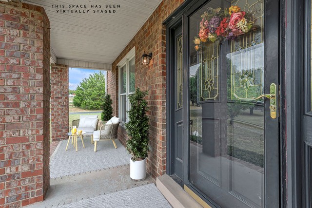 2103 Liebengood Road Goodlettsville, TN 37072 - Photo 4 of 97 a view of a porch with chairs and potted plants