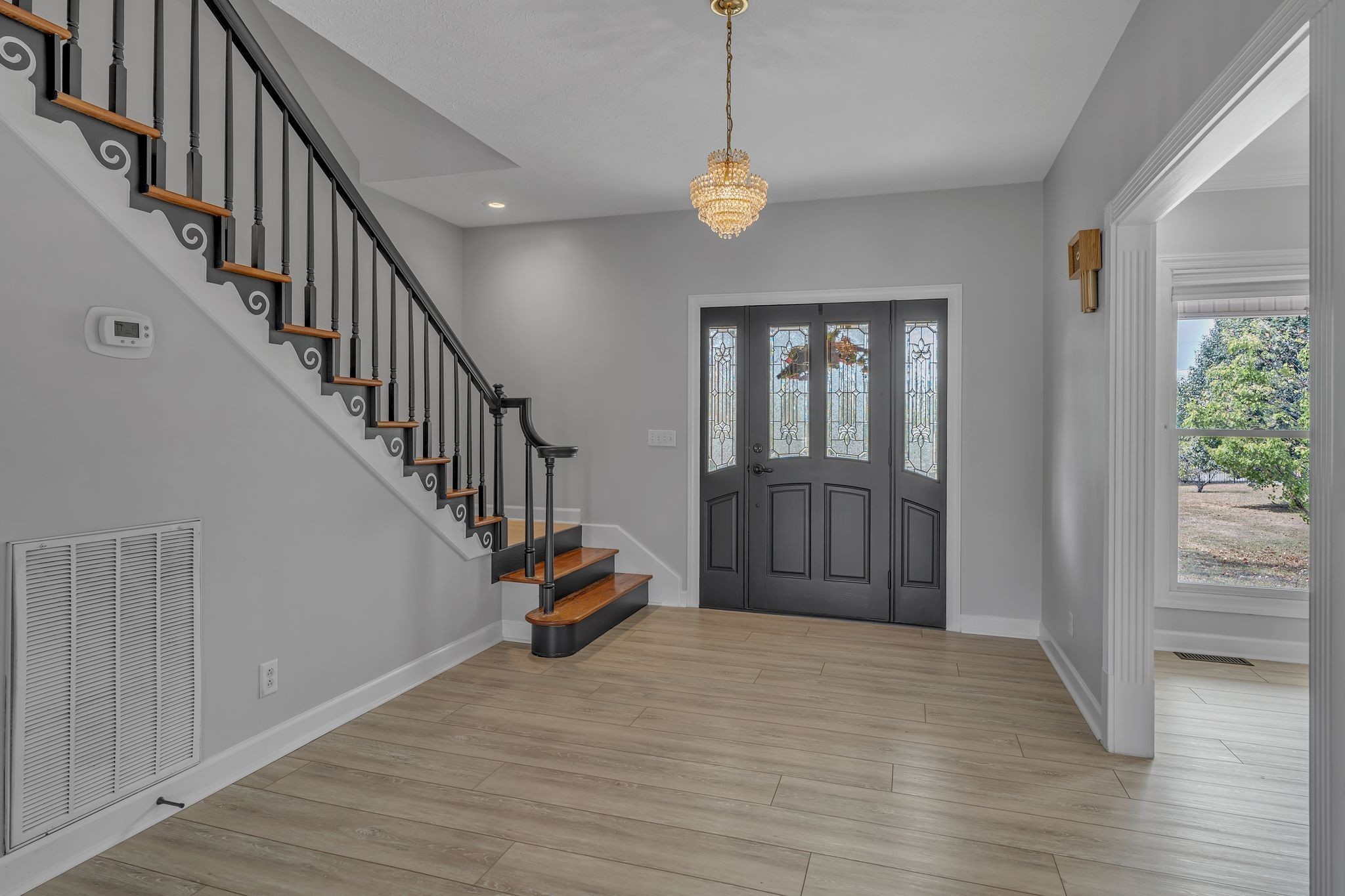 2103 Liebengood Road Goodlettsville, TN 37072 - Photo 8 of 97 a view of a livingroom with wooden floor and stairs
