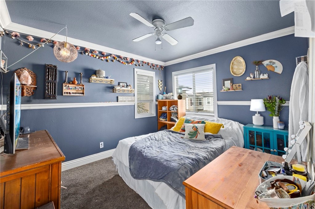 845 Dans Place Brea, CA 92821 - Photo 25 of 31 a bedroom with a bed and a chandelier