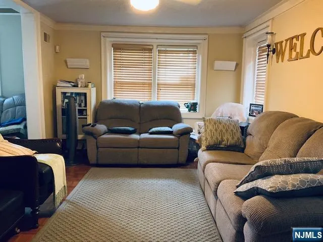 a living room with a couch and a window