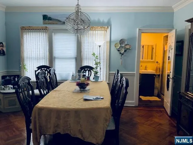 a view of a dining room with furniture and window