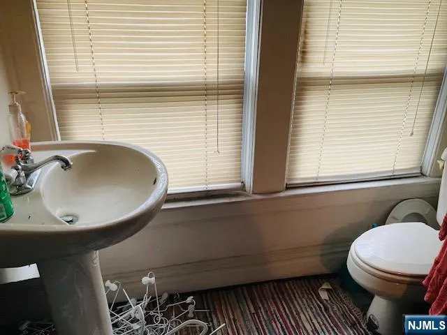 a bathroom with a sink and a toilet