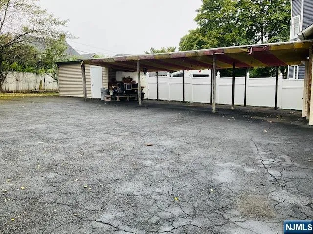 a view of house with backyard and furniture