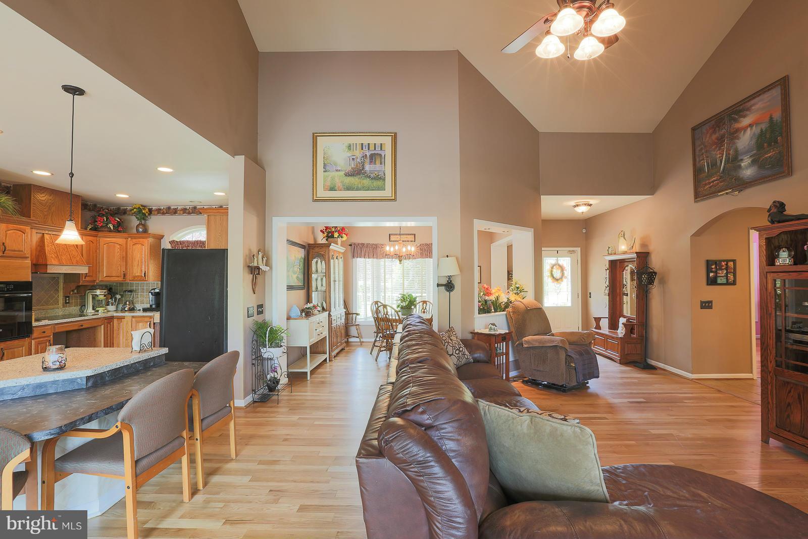 5020 Forge Road Perry Hall, MD 21128 - Photo 12 of 30 a living room with furniture and a chandelier