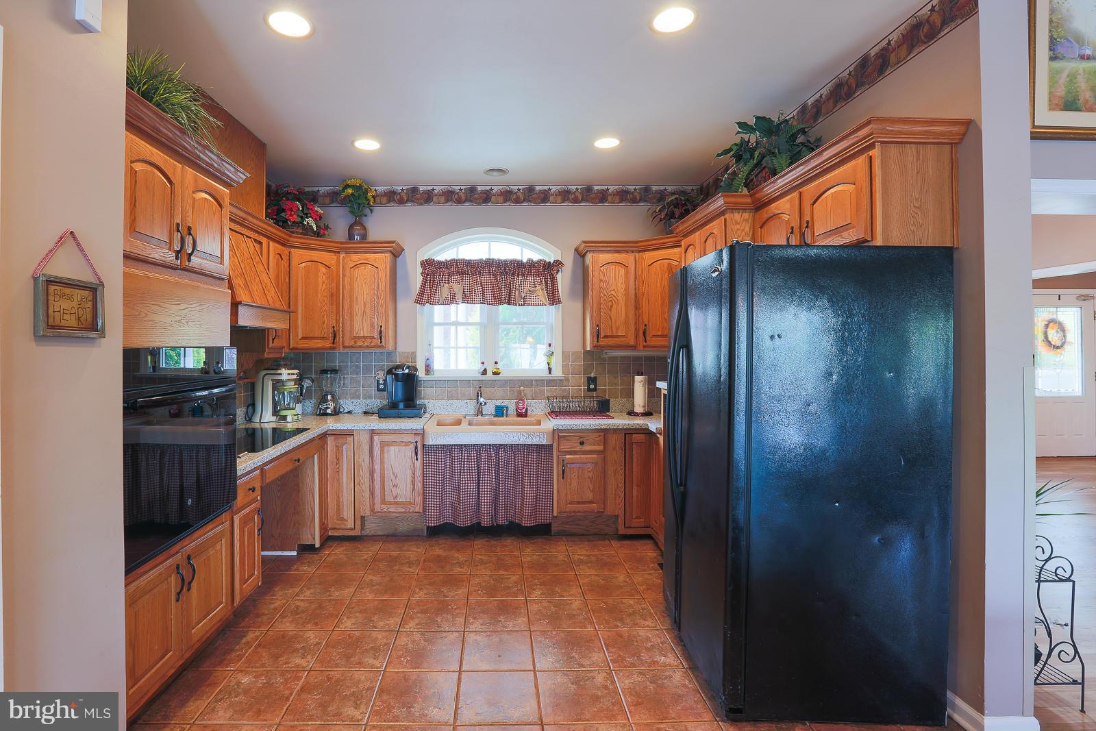 5020 Forge Road Perry Hall, MD 21128 - Photo 14 of 30 a large kitchen with stainless steel appliances granite countertop a refrigerator and a sink