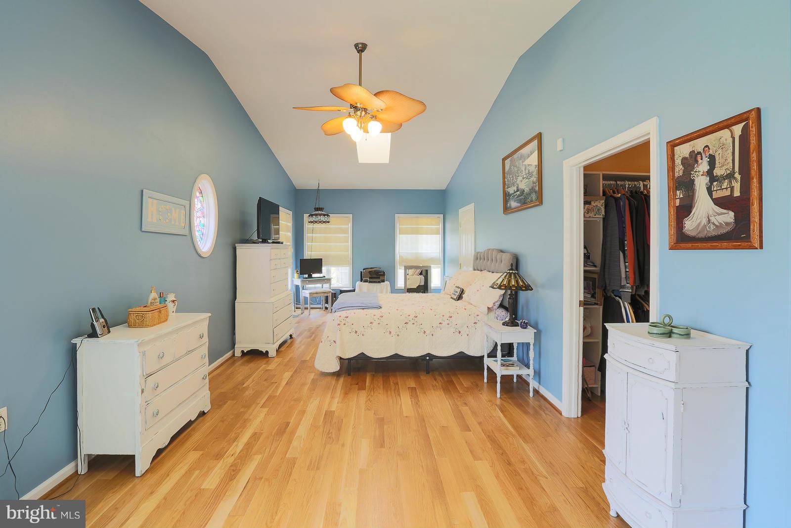 5020 Forge Road Perry Hall, MD 21128 - Photo 21 of 30 a bed room with a bed and a chandelier