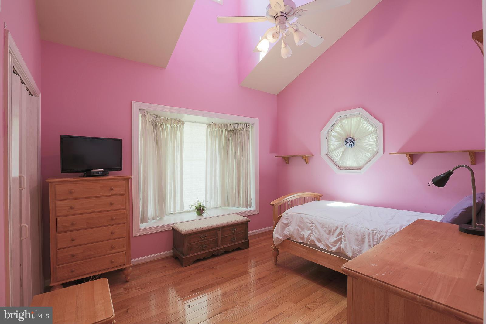 5020 Forge Road Perry Hall, MD 21128 - Photo 27 of 30 a bedroom with a bed a dresser and flat screen tv