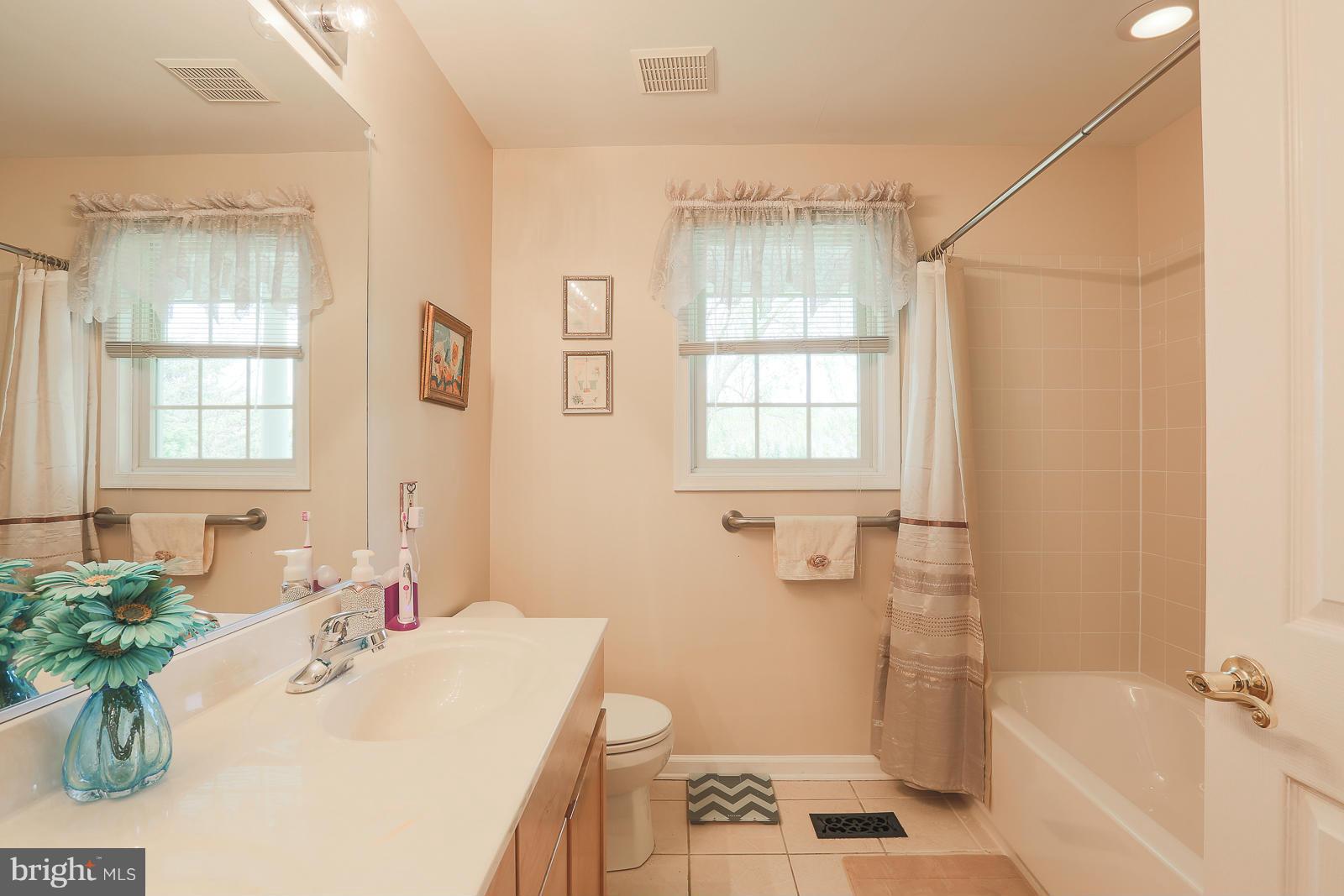5020 Forge Road Perry Hall, MD 21128 - Photo 28 of 30 a bathroom with a sink a toilet a tub and shower