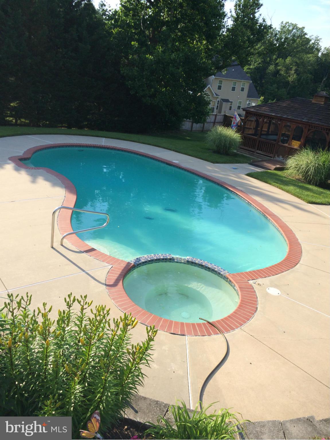 5020 Forge Road Perry Hall, MD 21128 - Photo 5 of 30 a view of a swimming pool with a yard