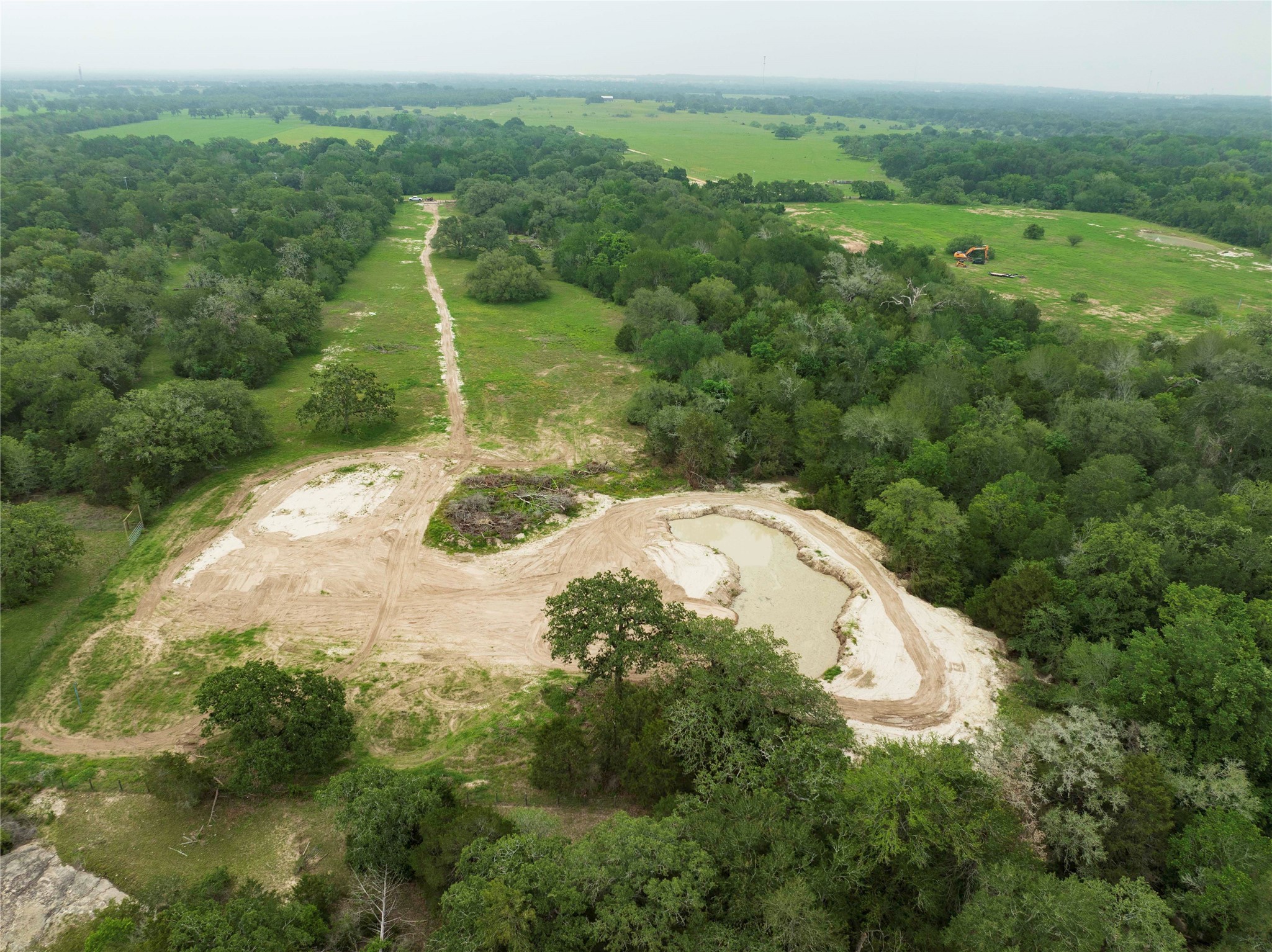 2570 Burke Road Flatonia, TX 78941 - Photo 12 of 14 a view of a forest with a street