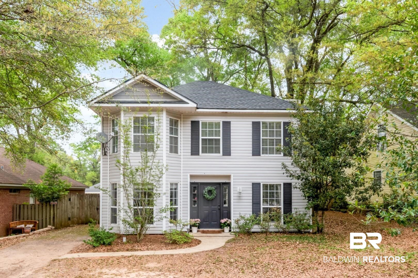 1065 Linlen Avenue Mobile, AL 36609 - Photo 1 of 31 Colonial house with a shingled roof and fence