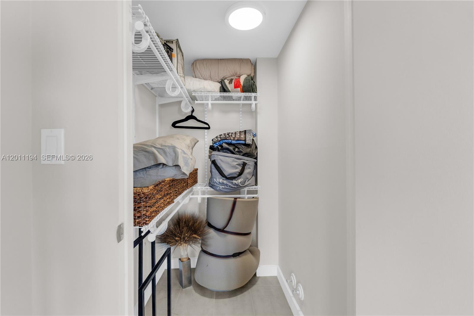 1000 Quayside Terrace, Unit 703 Miami, FL 33138 - Photo 24 of 31 a close view of shoes and cabinets