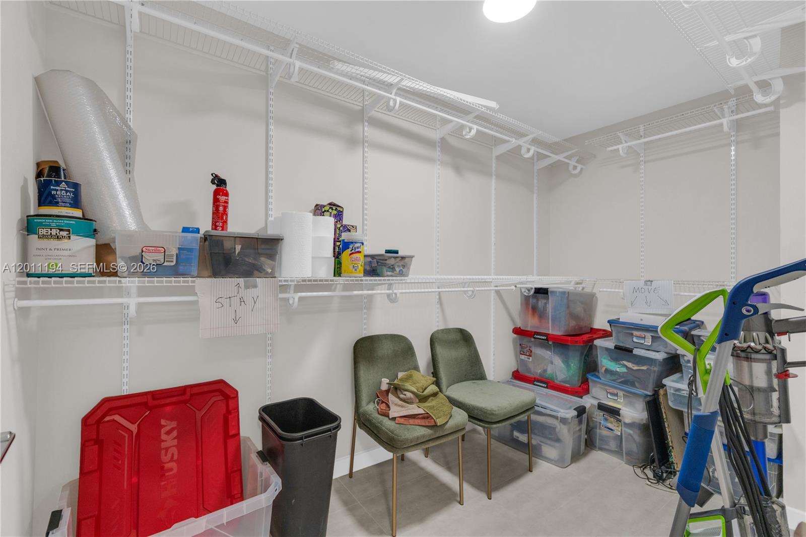 1000 Quayside Terrace, Unit 703 Miami, FL 33138 - Photo 25 of 31 a workspace with furniture a rug and a closet