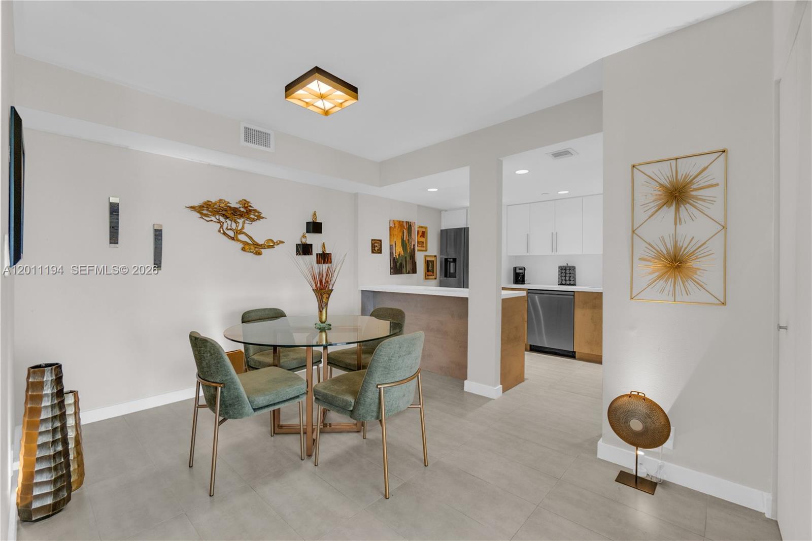 1000 Quayside Terrace, Unit 703 Miami, FL 33138 - Photo 7 of 31 a dining room with furniture and window