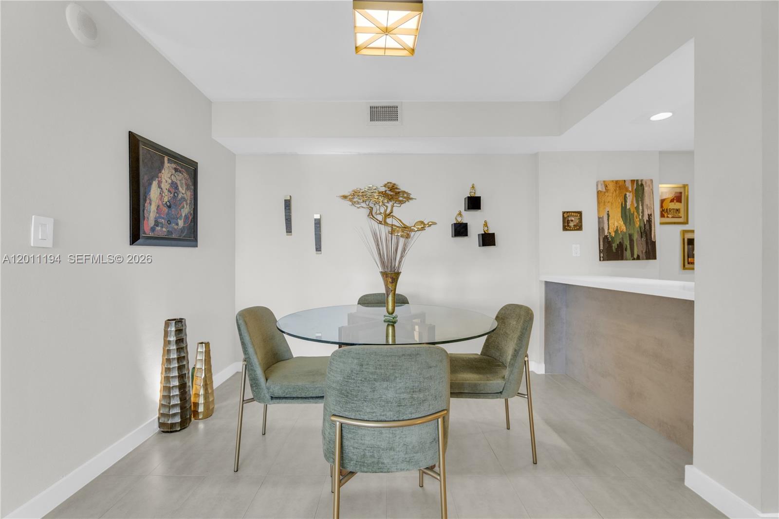 1000 Quayside Terrace, Unit 703 Miami, FL 33138 - Photo 8 of 31 a dining room with furniture and window
