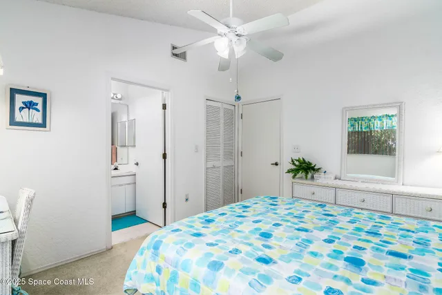 a bedroom with a bed dresser and a window