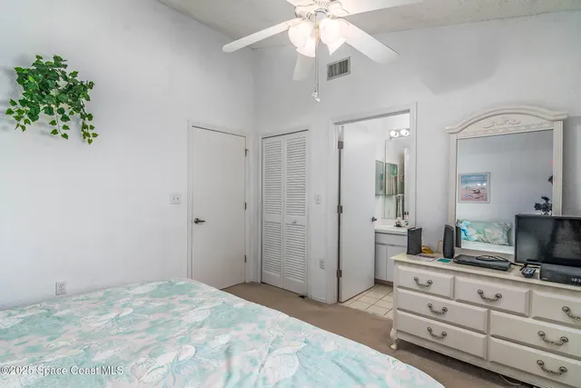 a spacious bathroom with a double vanity sink and a mirror