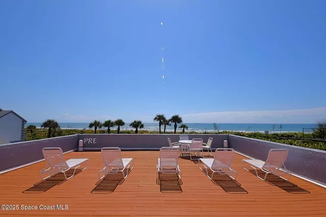 a view of swimming pool with furniture