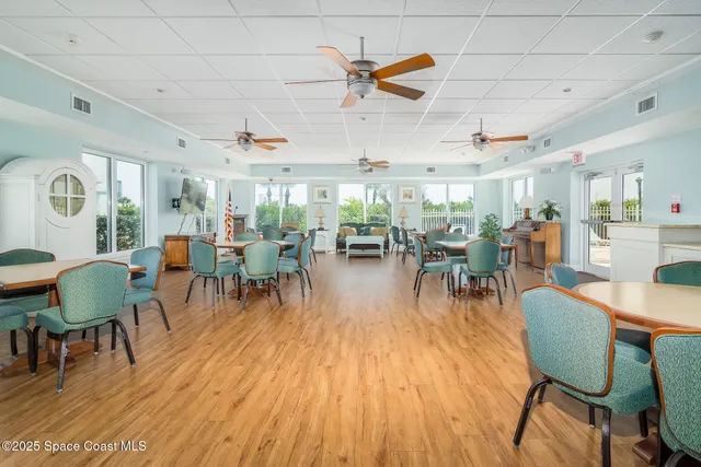 a dining room with lots of tables and chairs