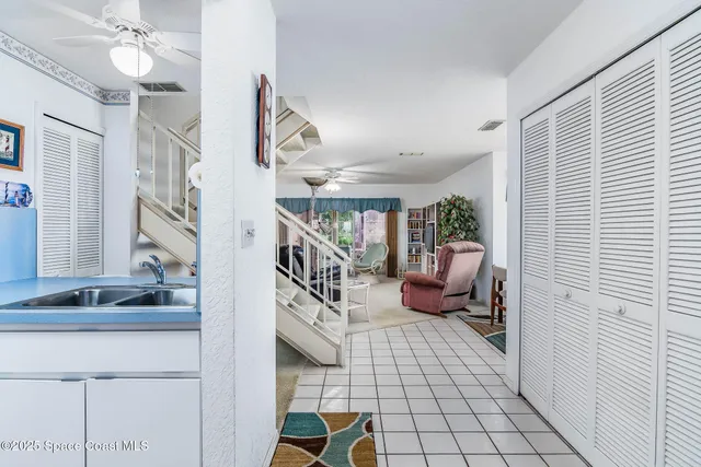 a view of entryway livingroom and hall with wooden floor