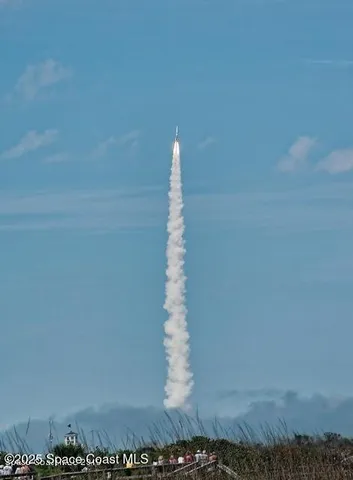 a view of a swimming pool with an outdoor seating